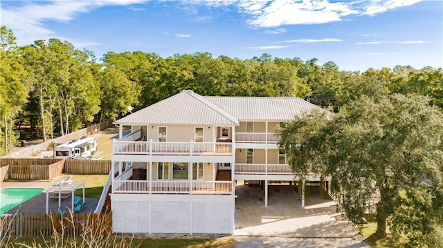 back of house with a balcony