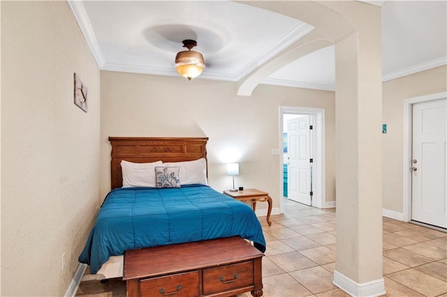 tiled bedroom with ceiling fan and ornamental molding