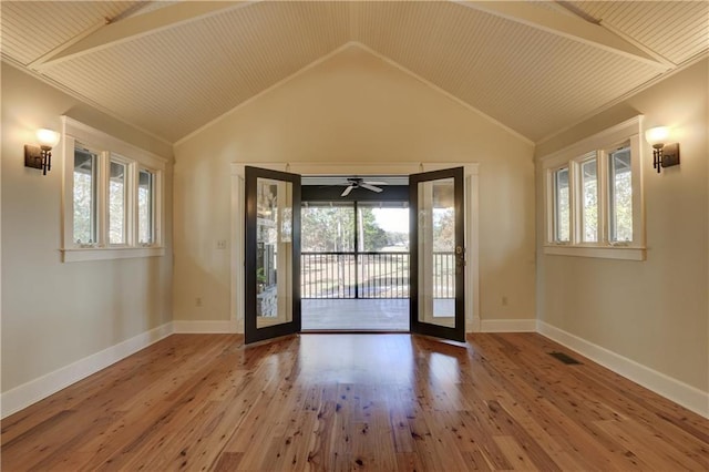 entryway featuring hardwood / wood-style floors, lofted ceiling with beams, and wooden ceiling