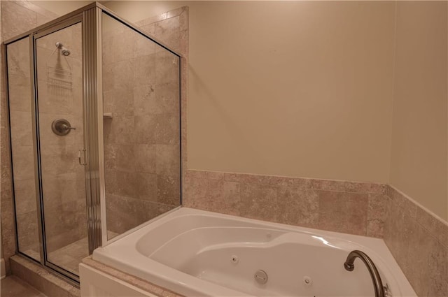 bathroom featuring shower with separate bathtub