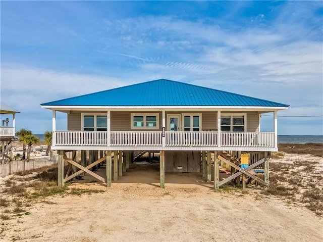 back of house with a carport