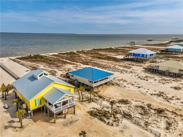 aerial view featuring a water view and a beach view