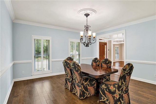 5555 Briarfield Ln, Mobile, AL 36693 - dining area featuring a chandelier, ornamental molding, and dark wood-style flooring