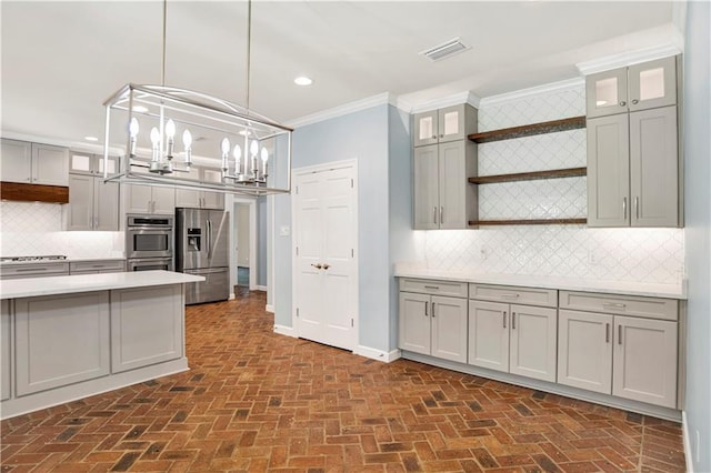 5555 Briarfield Ln, Mobile, AL 36693 - kitchen with appliances with stainless steel finishes, open shelves, brick floors, light countertops, and ornamental molding