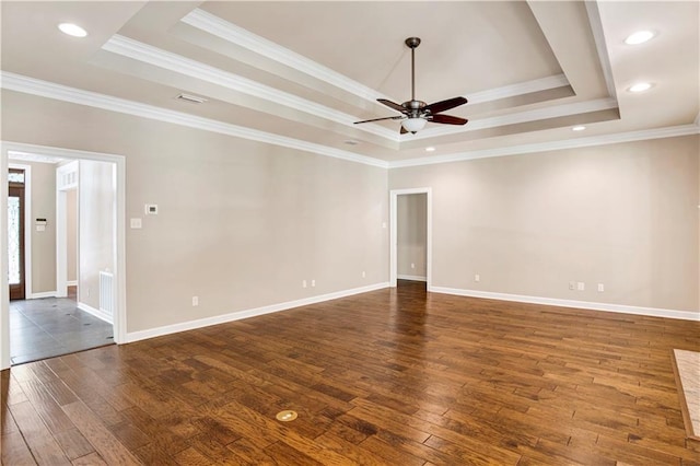 5555 Briarfield Ln, Mobile, AL 36693 - empty room with a tray ceiling, dark wood-style flooring, ceiling fan, ornamental molding, and recessed lighting