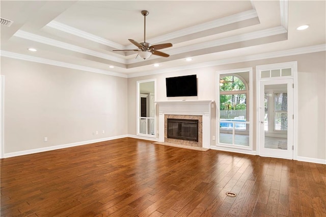 5555 Briarfield Ln, Mobile, AL 36693 - unfurnished living room with a raised ceiling, dark wood finished floors, ceiling fan, a fireplace, and ornamental molding