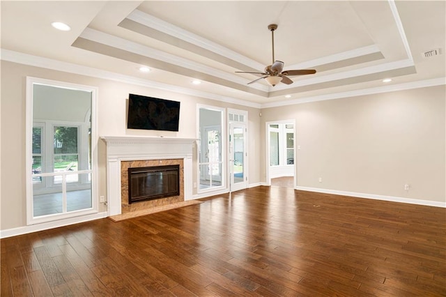 5555 Briarfield Ln, Mobile, AL 36693 - unfurnished living room featuring a raised ceiling, a ceiling fan, dark wood-style flooring, a premium fireplace, and ornamental molding