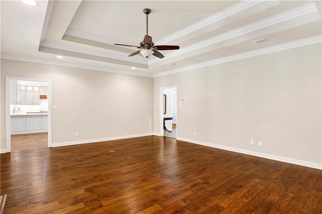5555 Briarfield Ln, Mobile, AL 36693 - empty room featuring a raised ceiling, dark wood-style floors, ceiling fan, ornamental molding, and recessed lighting