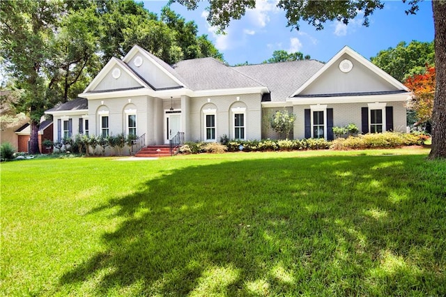5555 Briarfield Ln, Mobile, AL 36693 - view of front facade with a front lawn and brick siding