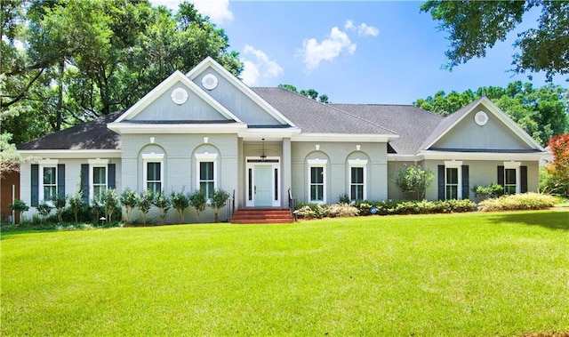 5555 Briarfield Ln, Mobile, AL 36693 - view of front of home featuring brick siding, a front yard, and roof with shingles