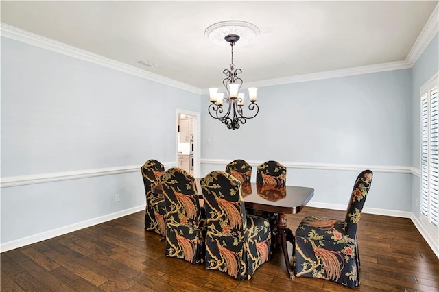 5555 Briarfield Ln, Mobile, AL 36693 - dining room featuring hardwood / wood-style flooring, a chandelier, and ornamental molding