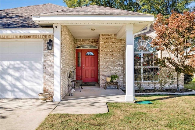 property entrance with a lawn