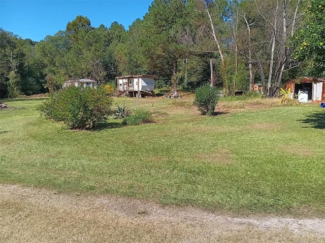 view of yard with a forest view