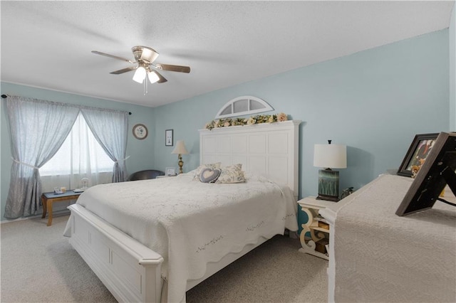 bedroom with light carpet and ceiling fan