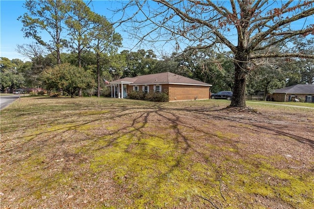 exterior space with a yard