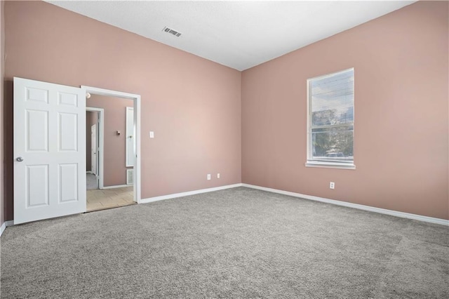 spare room with light carpet