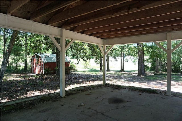 view of patio / terrace featuring an outbuilding and a storage unit