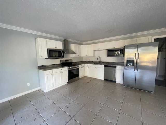 kitchen featuring wall chimney range hood, crown molding, sink, and appliances with stainless steel finishes