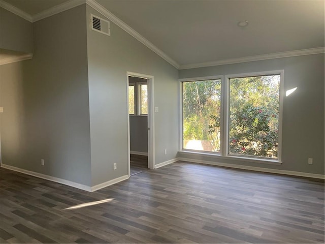 spare room with crown molding, vaulted ceiling, and dark hardwood / wood-style flooring