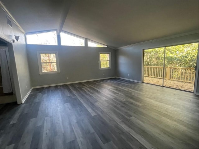 unfurnished living room with dark hardwood / wood-style flooring, vaulted ceiling, and ornamental molding