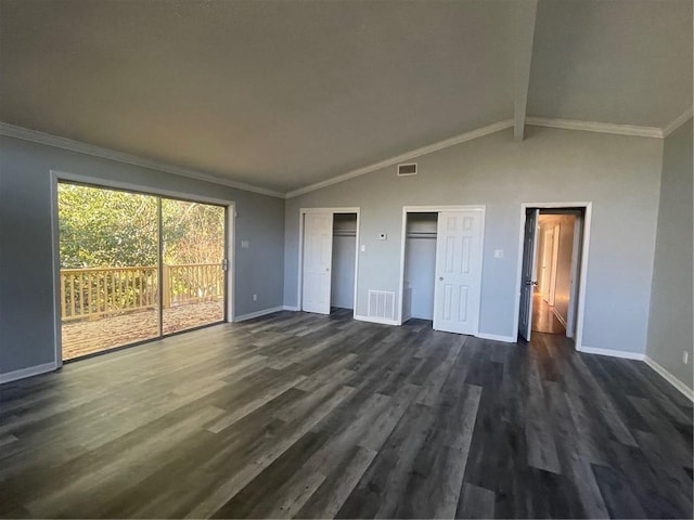 unfurnished bedroom with multiple closets, crown molding, dark wood-type flooring, and vaulted ceiling with beams