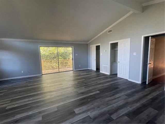 interior space with crown molding, access to outside, dark hardwood / wood-style flooring, two closets, and beam ceiling