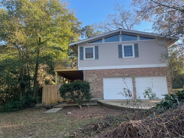 view of side of property featuring a garage and a balcony