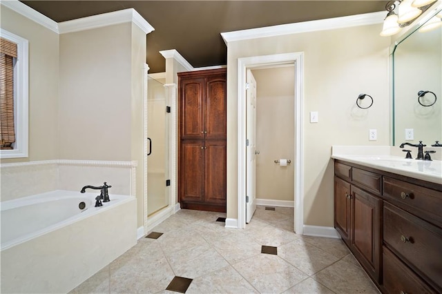 bathroom with a shower stall, crown molding, baseboards, a bath, and vanity