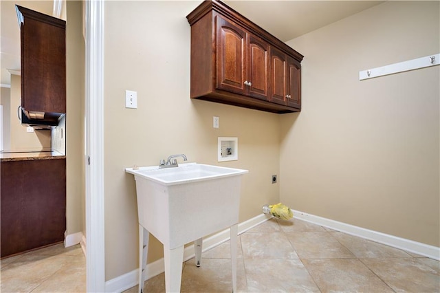 laundry room with baseboards, hookup for a washing machine, light tile patterned flooring, cabinet space, and electric dryer hookup