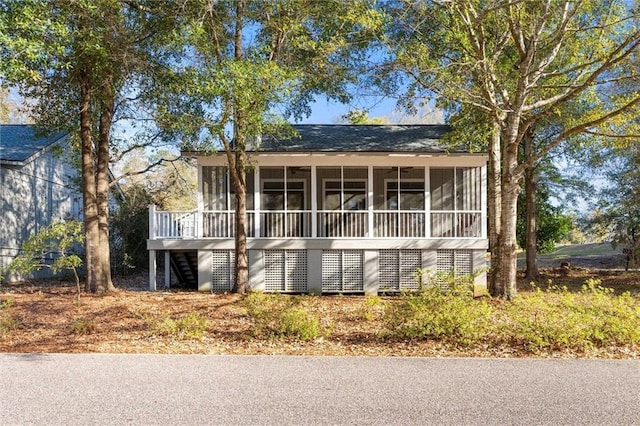 view of front of home with a sunroom