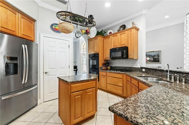 kitchen featuring crown molding, a center island, and black appliances