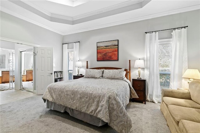 bedroom featuring ornamental molding, light colored carpet, a tray ceiling, and multiple windows