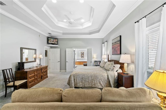 bedroom featuring a raised ceiling, light colored carpet, ceiling fan, and crown molding