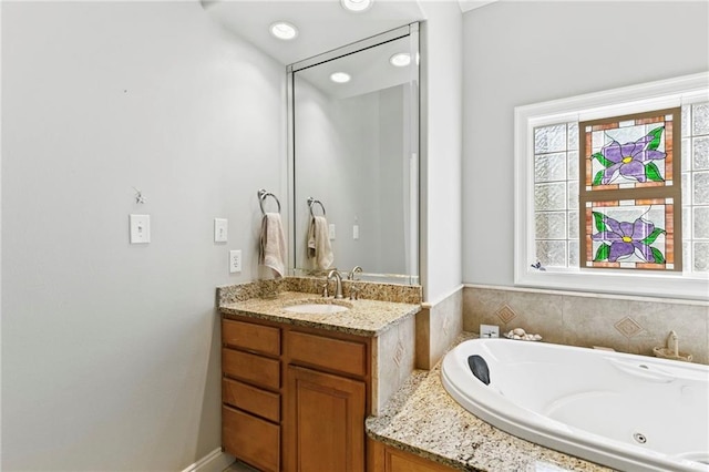 bathroom featuring vanity and a bathtub