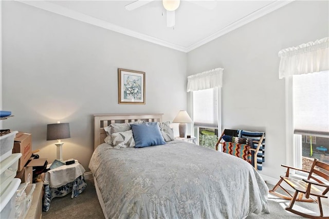 carpeted bedroom featuring ceiling fan, crown molding, and multiple windows