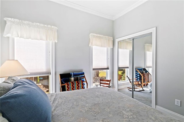 bedroom featuring a closet, carpet, crown molding, and multiple windows