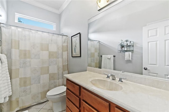 bathroom with toilet, vanity, tile patterned flooring, and crown molding