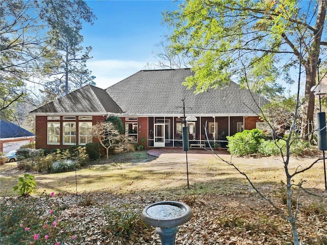 rear view of house with a sunroom