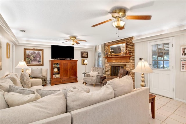 living room with light tile patterned floors, a brick fireplace, and crown molding