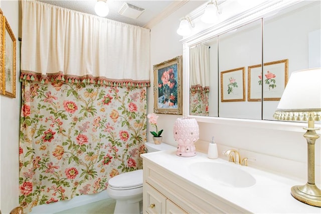 bathroom with curtained shower, crown molding, vanity, and toilet