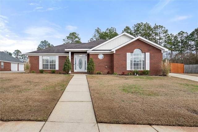 single story home featuring a front lawn