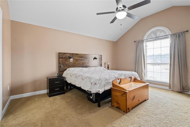 carpeted bedroom featuring vaulted ceiling and ceiling fan