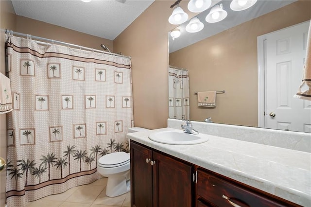 bathroom with tile patterned floors, toilet, and vanity