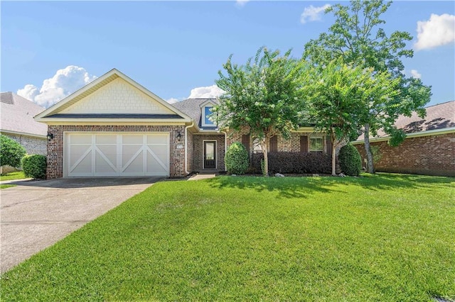 view of front of home with a garage and a front yard