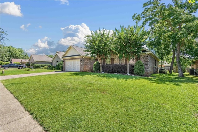 view of front facade with a garage and a front lawn