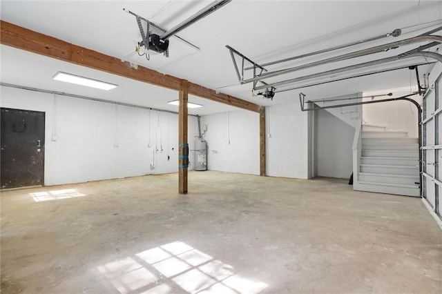 garage featuring a garage door opener and water heater