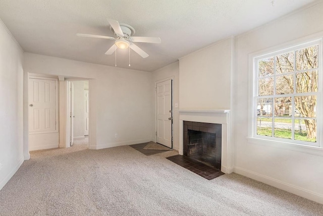 unfurnished living room featuring ceiling fan and dark carpet