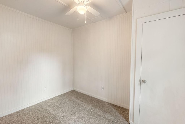 spare room with ceiling fan and carpet flooring