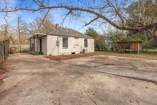 view of side of home with cooling unit