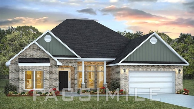 2295 Nadine Ln, Mobile, AL 36695 - view of front of home with board and batten siding, brick siding, and a yard